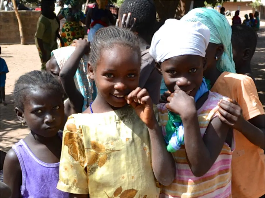 Shy smiles in The Gambia