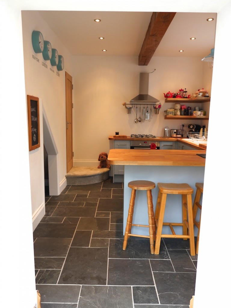 Blue kitchen with slate tiles