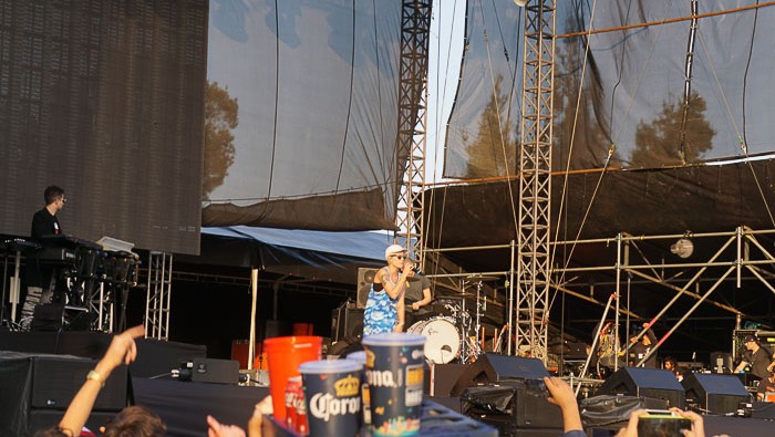 Halsey performing and a beer carrying server!