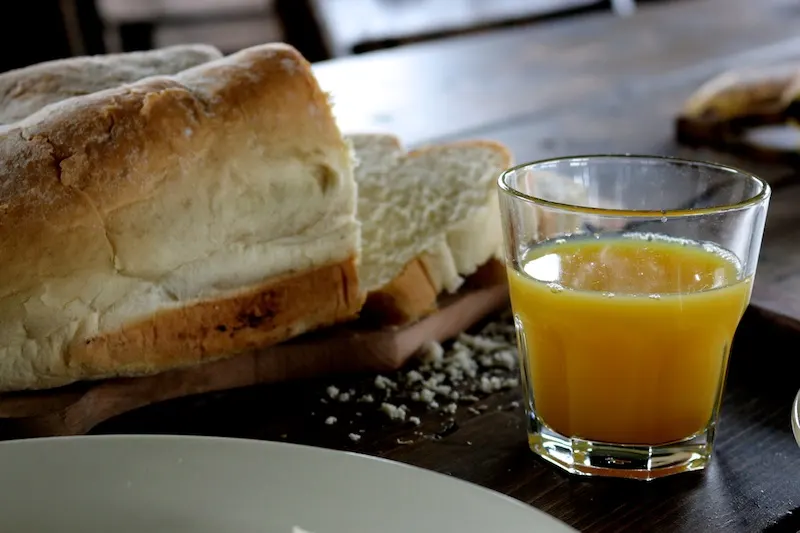 Featherdown Glamping in Lancaster - bread and orange juice from breakfast hamper