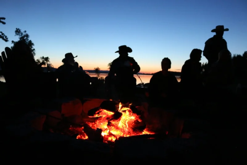 cowboys-around-the-campfire-at-flathead-lake-lodge