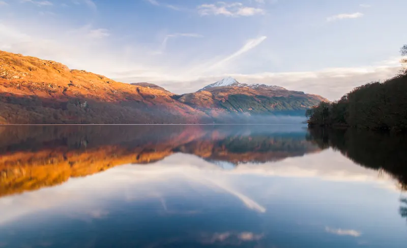 A misty Loch Lomond at sunrise.