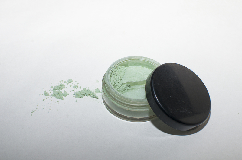 Container of green powder makeup - 10 Simple Sunburn Hacks to Soothe Your Skin