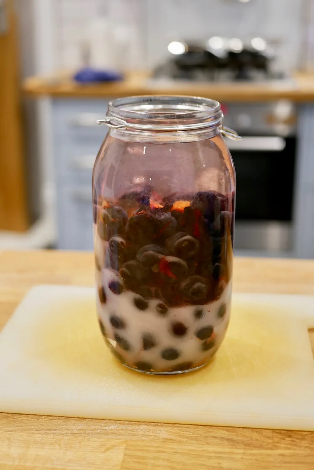 Making homemade damson gin