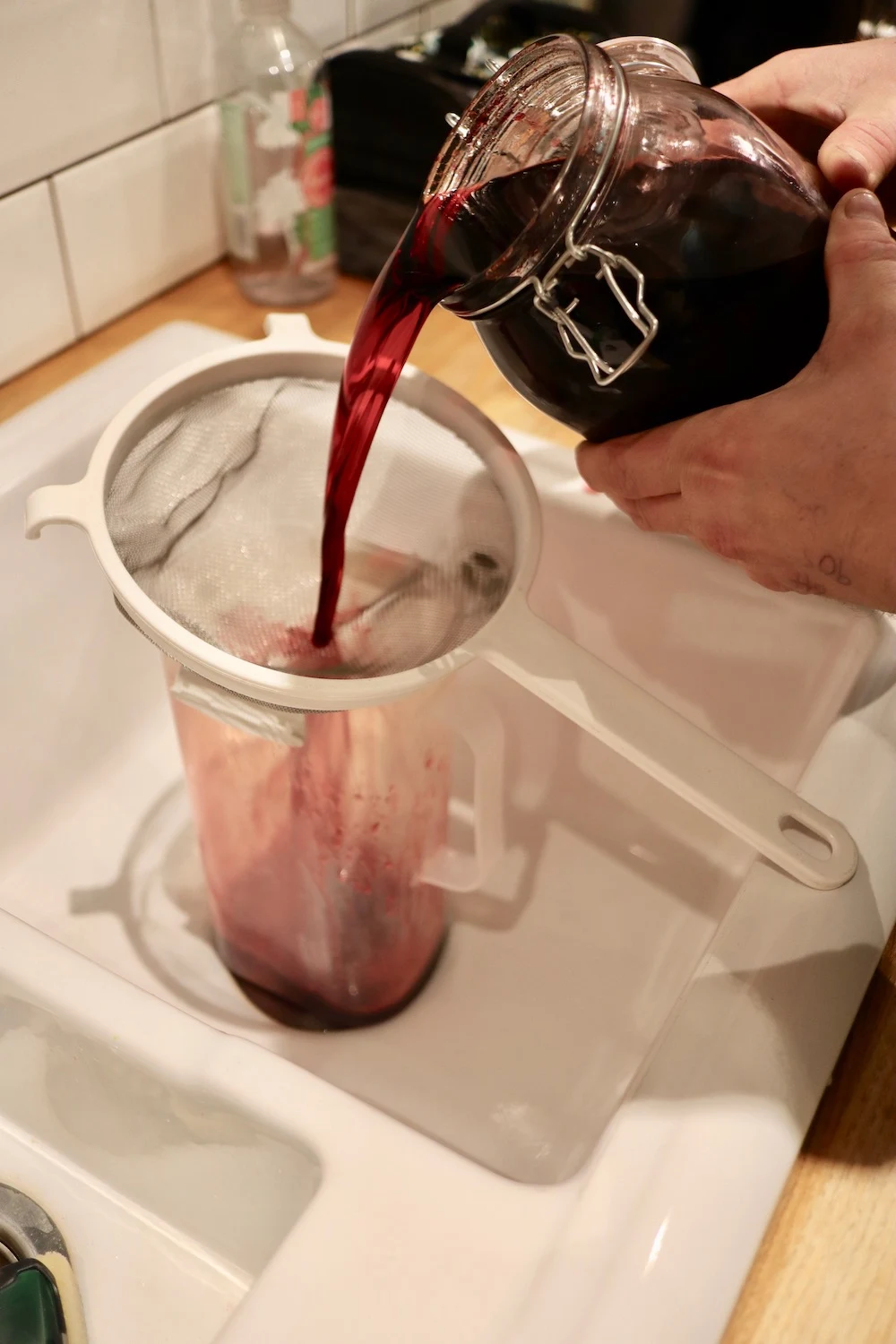 Making homemade damson gin