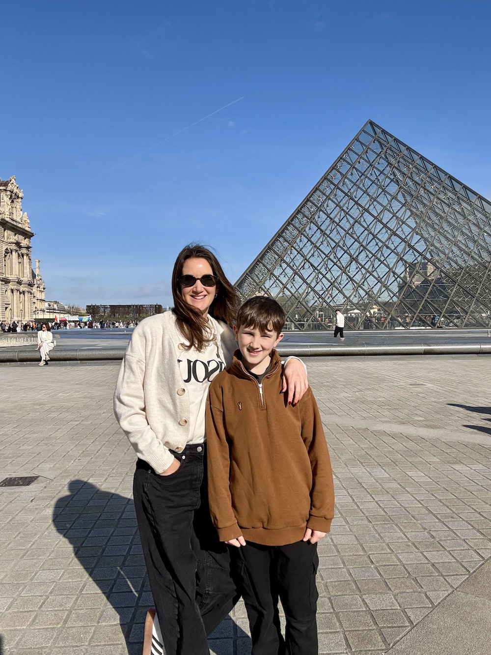 The Travel Hack and son taking a 1 day trip to Paris seen outside the Glass pyramids at the Louvre